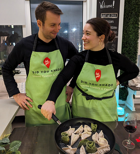 Couple learning how to cook in a class in Queens, NY